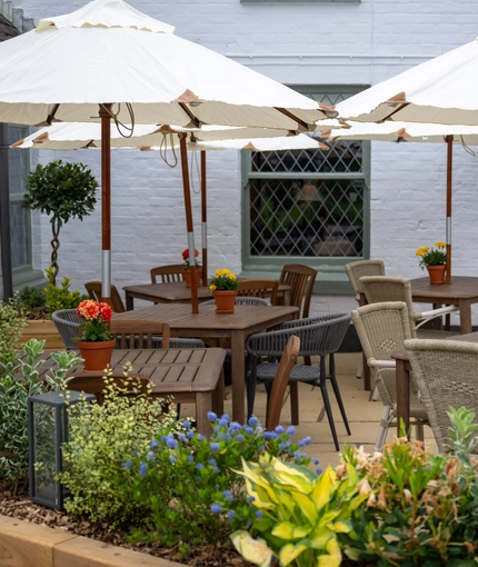 Some tables in the beer garden of the Grapes.
