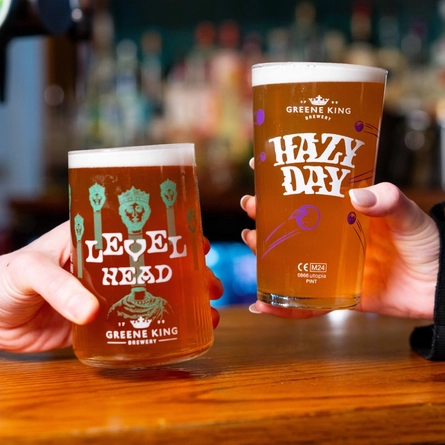 A pint of Level Head and a pint of Hazy day both served at the bar in a Urban Social venue.