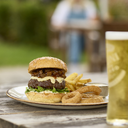 An exterior shot of a main burger dish served at Chef & Brewer venues.