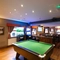 interior dining area of a pub with a pool table and a few gambling machines