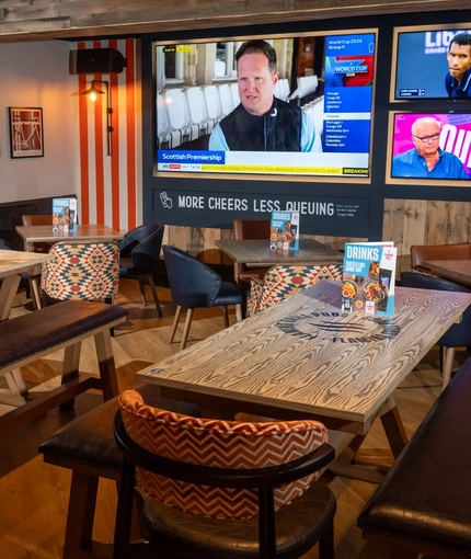 The interior restaurant and seating area with TV at the Man of Gwent.