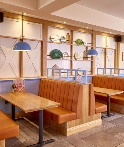 The interior restaurant seating booth area of the Farmhouse Kitchen in Silkwood Park.
