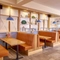 The interior restaurant seating booth area of the Farmhouse Kitchen in Silkwood Park.