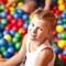 A child in the Wacky Warehouse ball pit