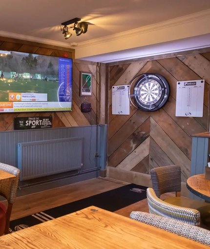 interior pub games with tv and dart board