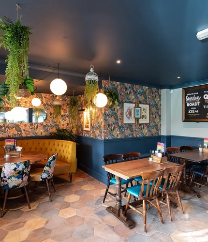 interior of the pub with dining tables and chairs