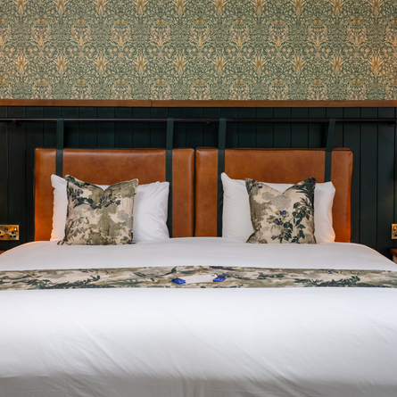 A bed in one of the hotel rooms at Himley House.