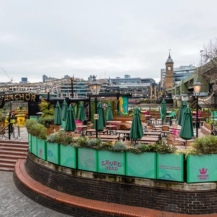 Beautiful exterior image of the beer garden with the view of the city in the background