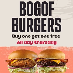 A graphic promoting buy one get one free burgers at Flaming Grill.