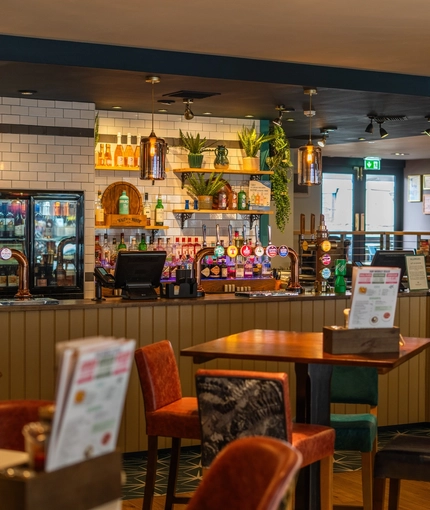 The bar and interior restaurant seating area of The Merlin in Edinburgh.