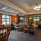 Interior dining area of a pub with a TV.