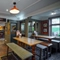 Interior dining area of a pub with a bar.