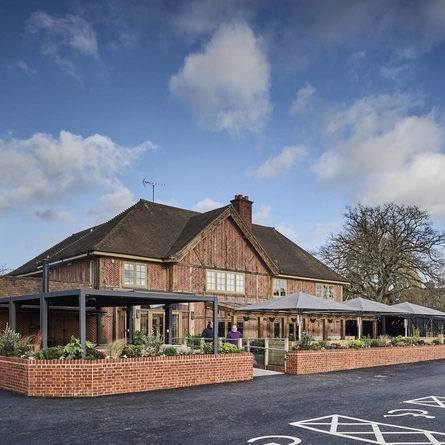 The exterior venue signage with venue, beer garden seating area and car park in the background at The Foundry Bell.