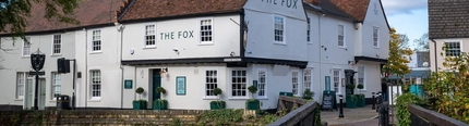 The exterior facade and signage of The Fox in Bury St Edmunds.