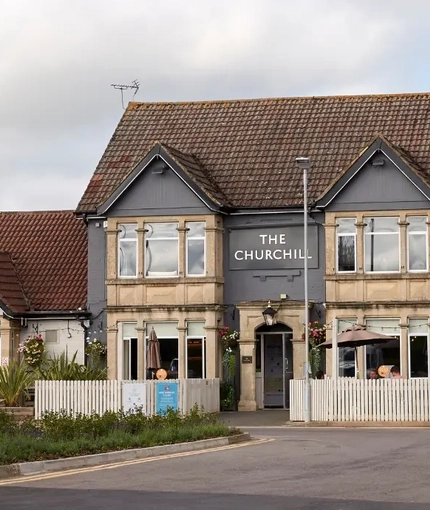 The exterior facade and venue signage at The Churchill.