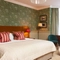 Hotel room with double bed and dressing table 