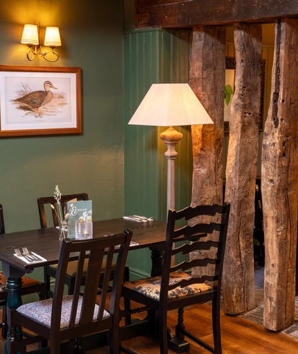 Some tables in the restaurant of the Grapes.