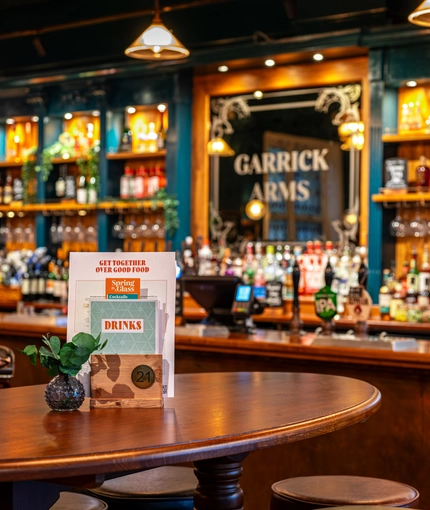 The bar and interior seating area of the Garrick Arms in Charing Cross.