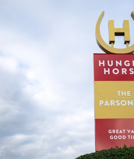 A close up view of the exterior signage of The Parsonage in Leigh. 