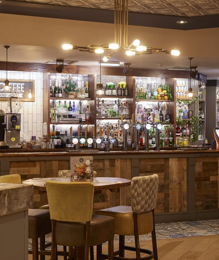 The interior bar and restaurant seating area at The Caledonian Hotel.