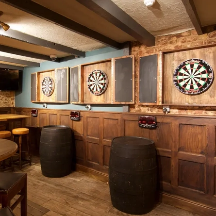 Metro - Williams Ale and Cider House (Whitechapel) - Three dartboards on the wall and an area for seating