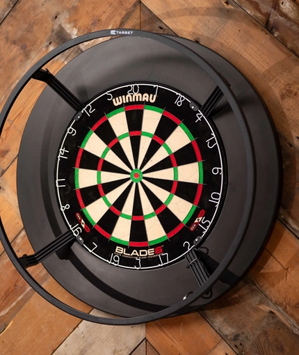 A close up image of a dartboard within the interior of The Old Red Lion.