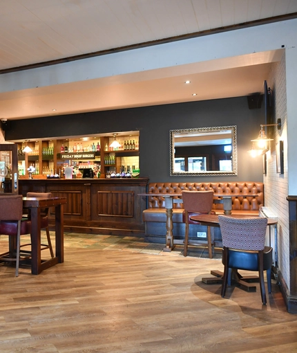 interior dining area of a pub with a bar