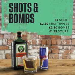 A graphic promoting Flaming Grill drinks shots & bombs Scotland.