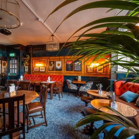 The interior restaurant seating area at The Sussex Arms.