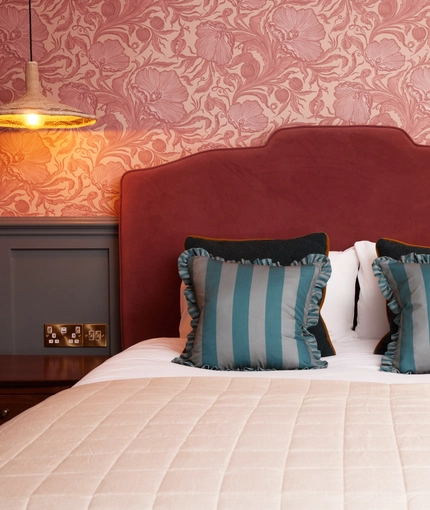 Hotel room double bed with bedside tables 
