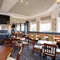 The interior restaurant and seating area with TV at the Black Horse.
