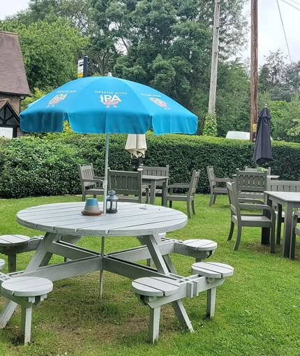 exterior beer garden of a pub with a seating area