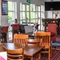 Interior dining area of a pub with a TV.