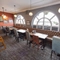 Interior dining area of a pub with a TV.