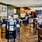 The interior restaurant seating area with pub games, at The Good Intent in Hornchurch.