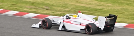 A Formula One car racing on a track.