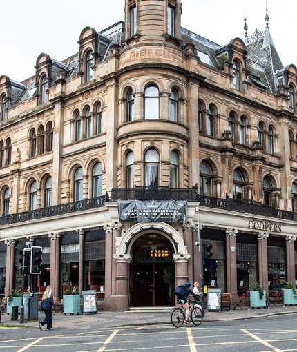 The exterior facade and street corner of Coopers in Glasgow.