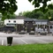 Exterior facade and beer garden of a pub with a seating area.