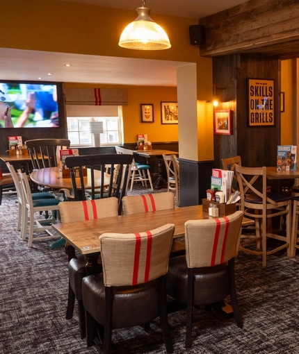 The interior restaurant and seating area with TV on the wall at the Man of Gwent.