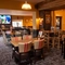 The interior restaurant and seating area with TV on the wall at the Man of Gwent.