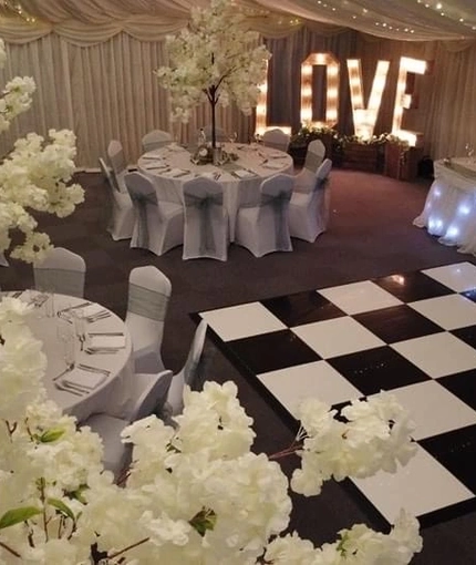 A marquee, decorated for a wedding.
