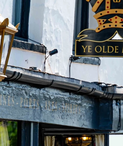 The exterior facade and signage of Ye Olde Mitre in Barnet.