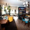 An interior shot of the main seating area, pub games & bar at The Palmeira in Hove.