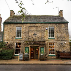 The exterior and entrance of The Rockingham Arms.