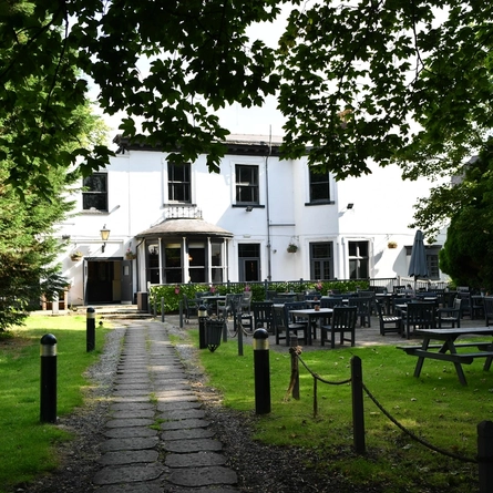 The beer garden and exterior of The Garden House.