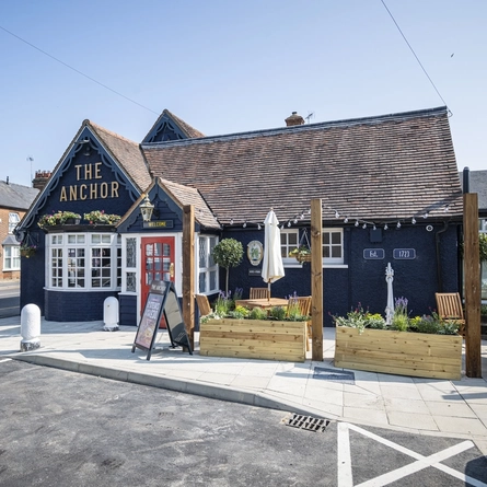 The exterior facade with seating area at the Anchor.
