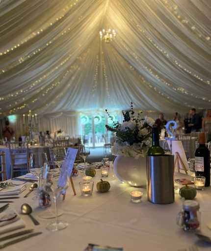 A marquee, decorated for a wedding.