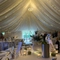 A marquee, decorated for a wedding.