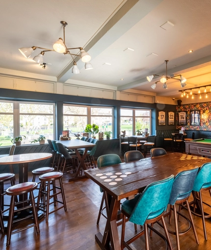 Interior seating area and pool table  of the Cricketers in Southwick