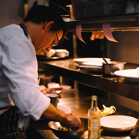 Metro - Black Swan (Ockham) - A chef prepares food at The Black Swan